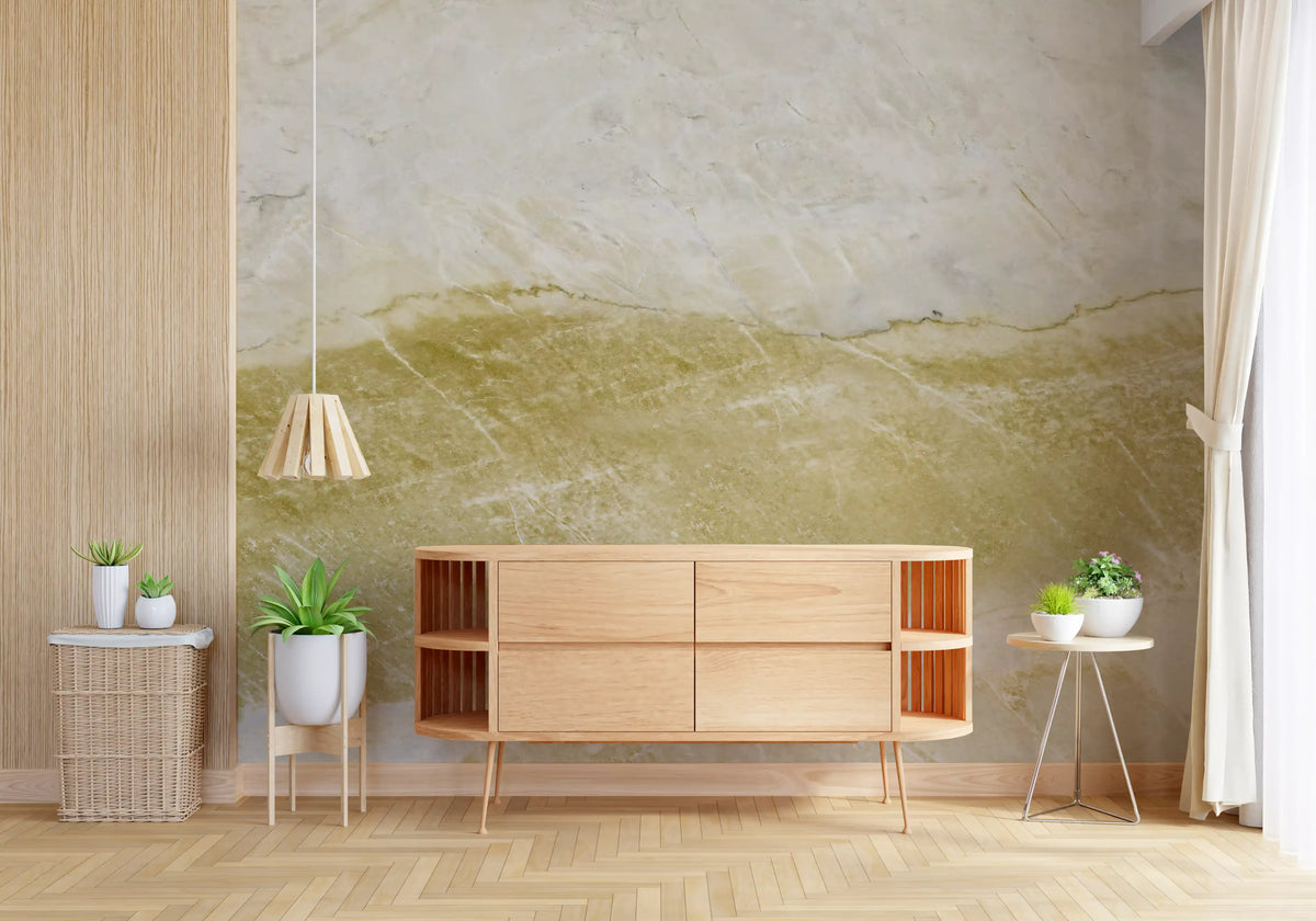 Marble wallpaper mural with an ochre gold band behind a wooden sideboard and potted plants GD14050