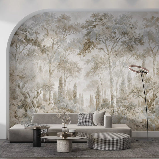 Forest wallpaper in an arched alcove behind a low gray sofa and round tables GD14180