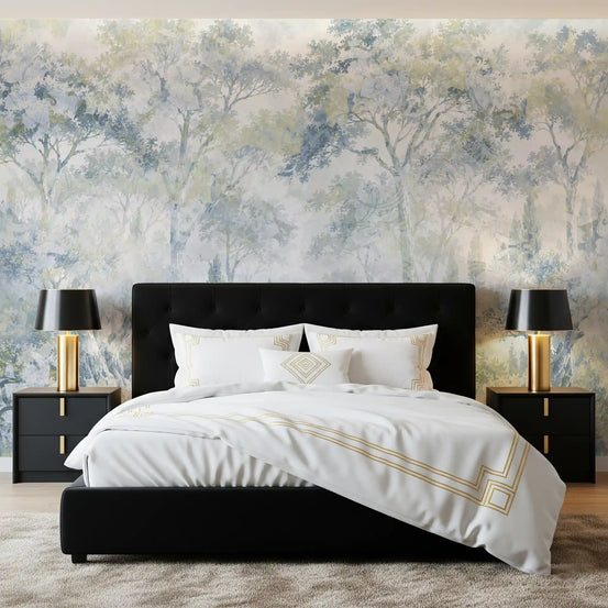 Forest wallpaper behind a black tufted bed with gold lamps and black nightstands GD14181