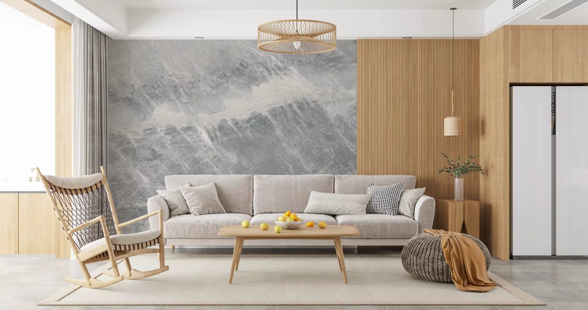 Rocking chair and beige sofa beside wood panels on a soft gray marble mural GD14203