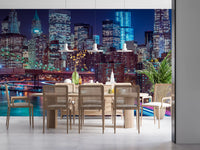 Dining room with rattan chairs and pendant lights under a glowing city mural GD14205