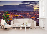 Cream sofa, rattan armchair and round tables before a Rome dusk panorama GD14206