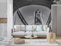 White sofa with wood frame, mint cushion and woven pouf by a bridge arch mural GD14209