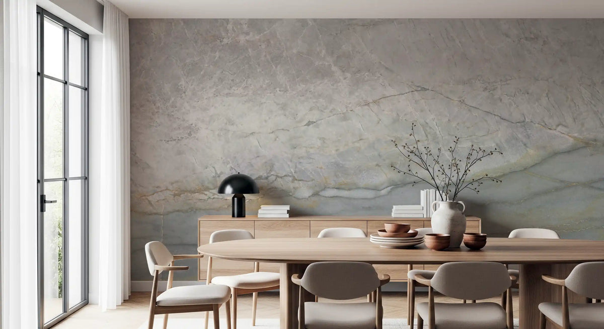 Marble wallpaper behind a round oak dining table with gray chairs and a sideboard GD14215