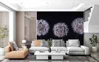 White sectional sofa and tan armchair in a bright lounge against black dandelion wallpaper GD14218