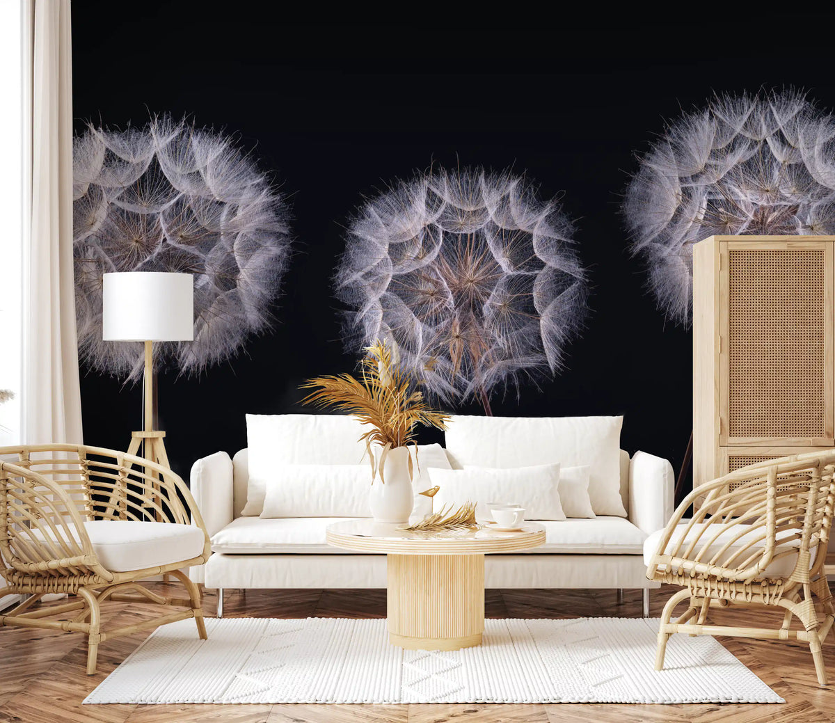 Cream sofa, rattan armchairs and round wood table in front of a monochrome seed head mural GD14218