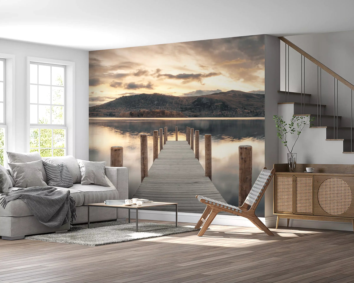 Gray sofa, wooden lounge chair and rattan sideboard by a staircase on a lake jetty wall mural GD14220