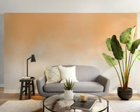 Serene peach watercolor wallpaper for living room walls.