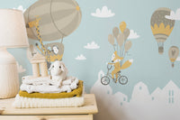 Playful fox and penguin balloon mural
