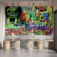 Trendy graffiti-inspired wall mural wallpaper for bold decor.