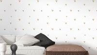 Delicate beige wallpaper with gold hearts