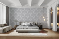 Minimalist grey damask wallpaper with a repeating white design.