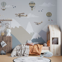 Airplanes flying over mountains wallpaper for kids room
