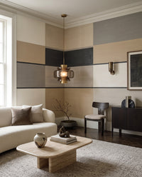 Living room styled around block-stripe Agnes Field wall mural in beige and grey tones.