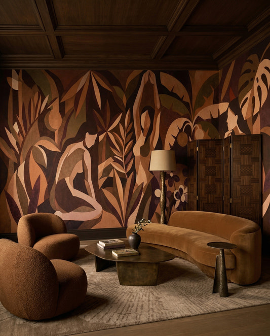 Amber Veil wall mural warms a living room with rust, plum, and sepia figures.