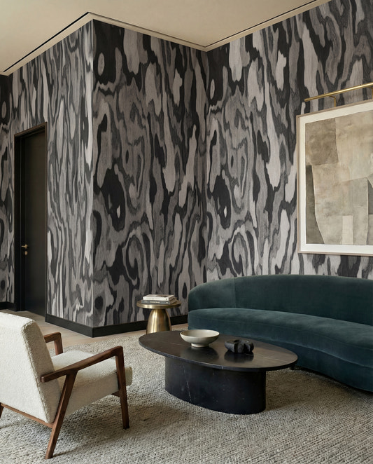 Ettore Root wall mural lends marbled monochrome rhythm to the living room.
