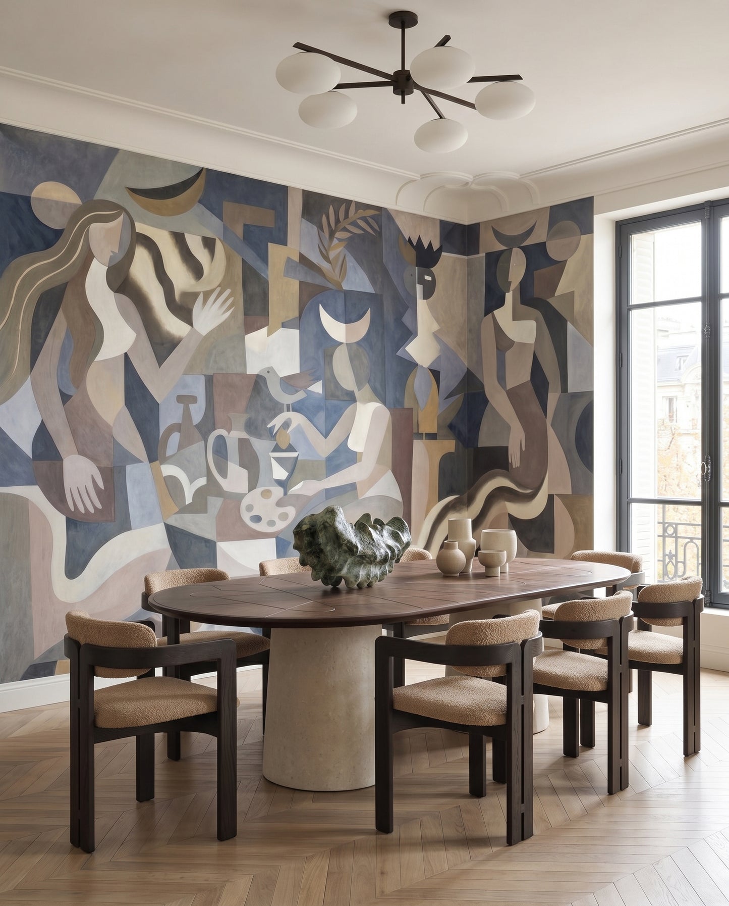 Dining room feature with the figure-led Lunar Eclipse wall mural under a sculptural chandelier.