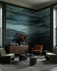 A quiet living room takes on dark peaks and rolling fog from the Roerich Hills wall mural.