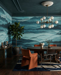 Slate peaks pull the lounge into a hushed view via the Roerich Hills wall mural.