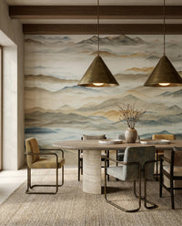 The misty mountain wall mural gives the dining room a quiet horizon backdrop.