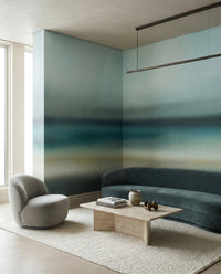 Lounge reading in cool teal and sand under the Rotko Blush wall mural