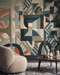 Living room styled around a Silent Planes wall mural in muted geometric tones