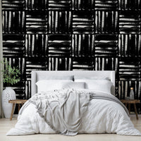 The image features abstract stripes that run vertically across the wall.
