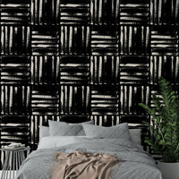 A full-wall mural showing a pattern of painted stripes.

