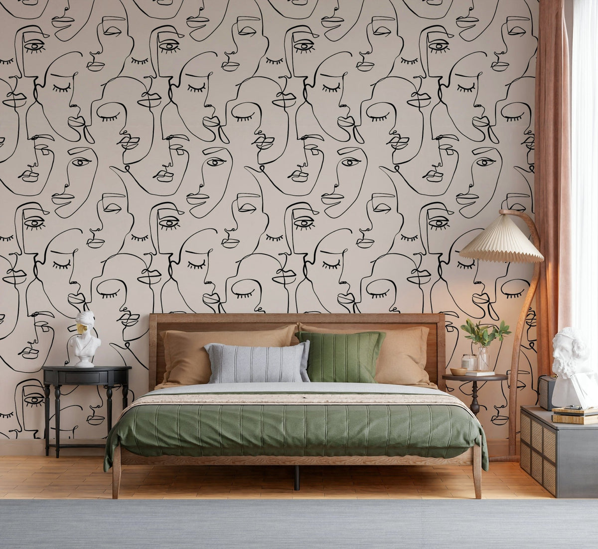 Abstract Faces Line Art wallpaper in black on cream behind a wooden bed with green bedding in a bedroom