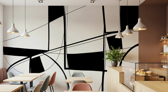Abstract Noir Lines wall mural with black lines and shapes on cream in a cafe with white pendant lights