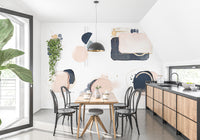 Artistic abstract shape mural with gold detailing.