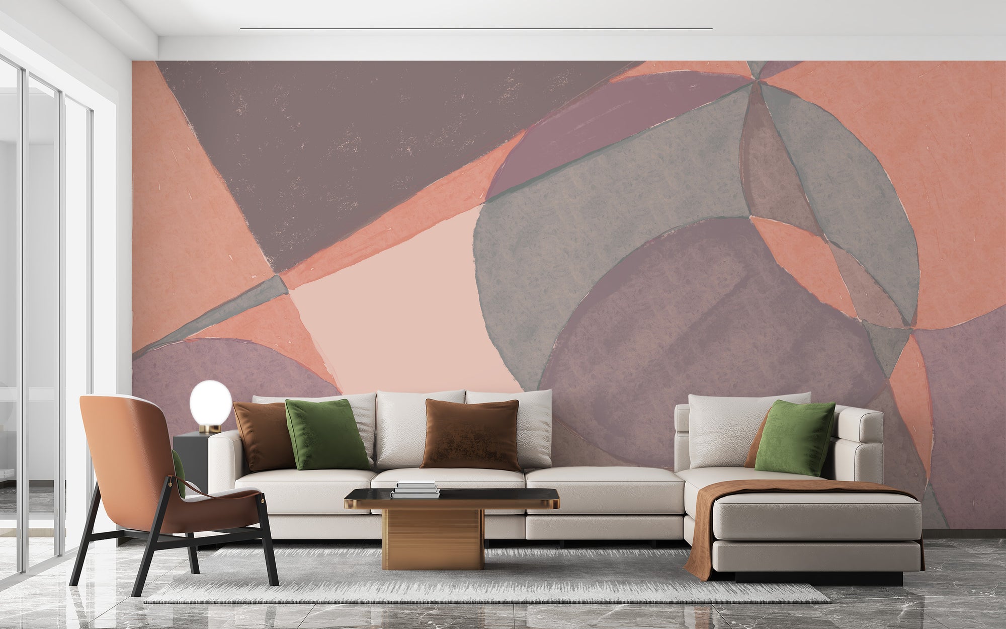Watercolor Illustration wallpaper mural in peach and mauve geometric shapes behind a cream sofa and terracotta chair in a living room