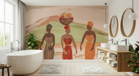 Echoes of the Motherland Wall Mural — lively depiction of African women in colorful attire bearing harvest.