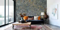 Decorative mural featuring distressed stone details in earthy neutral hues.