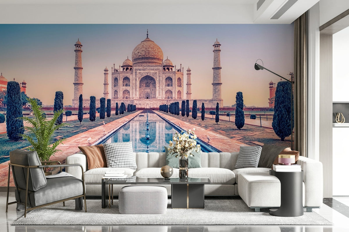 Agra's Jewel wallpaper mural showing the Taj Mahal and reflecting pool behind a teal sectional sofa in a living room