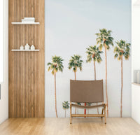 Retro hotel mural with palm trees and sunset view

