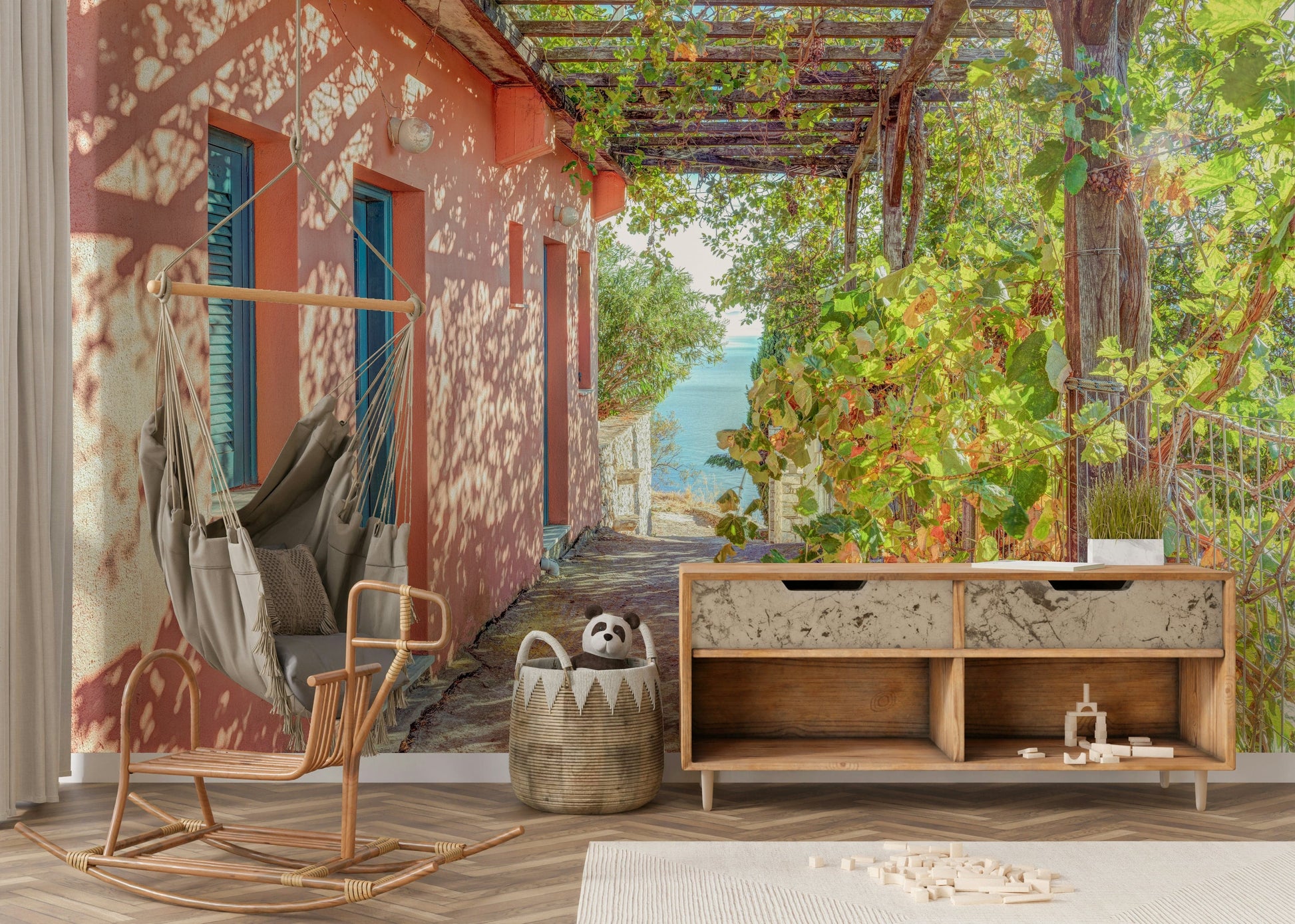 Charming Alonissos dwelling wallpaper shows grapevines and distant water.