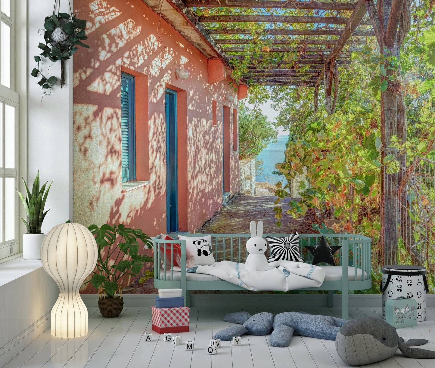 Peach villa exterior wall mural under wooden grapevine trellis, Greek island.