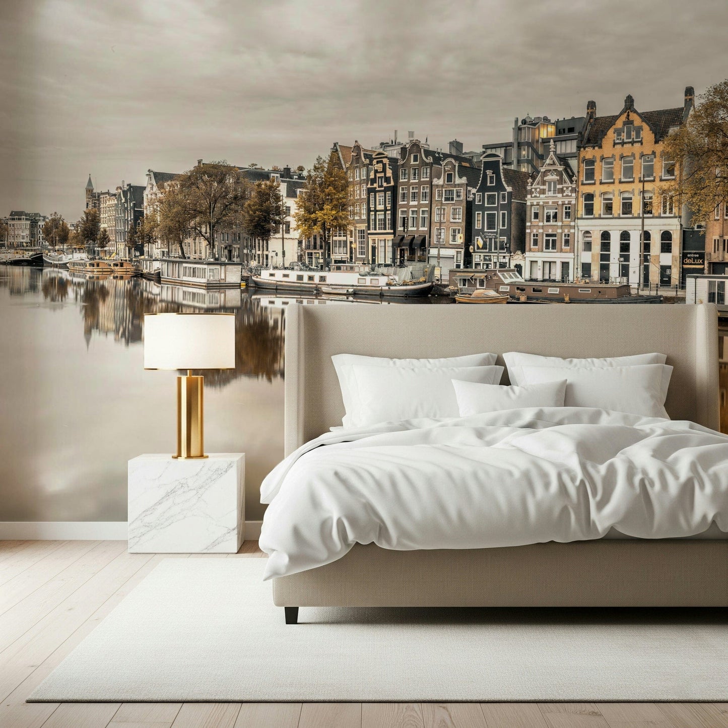 Cozy reading nook with Amsterdam canal reflection mural, neutral sofa and wood
