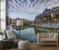 Amsterdam street watercolor wall mural behind sofa, airy apartment wall decor