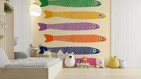 Playful wall mural featuring rainbow-colored fish on a cream background.

