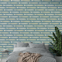 Playful fish wallpaper with soft cream and green colors on blue backdrop

