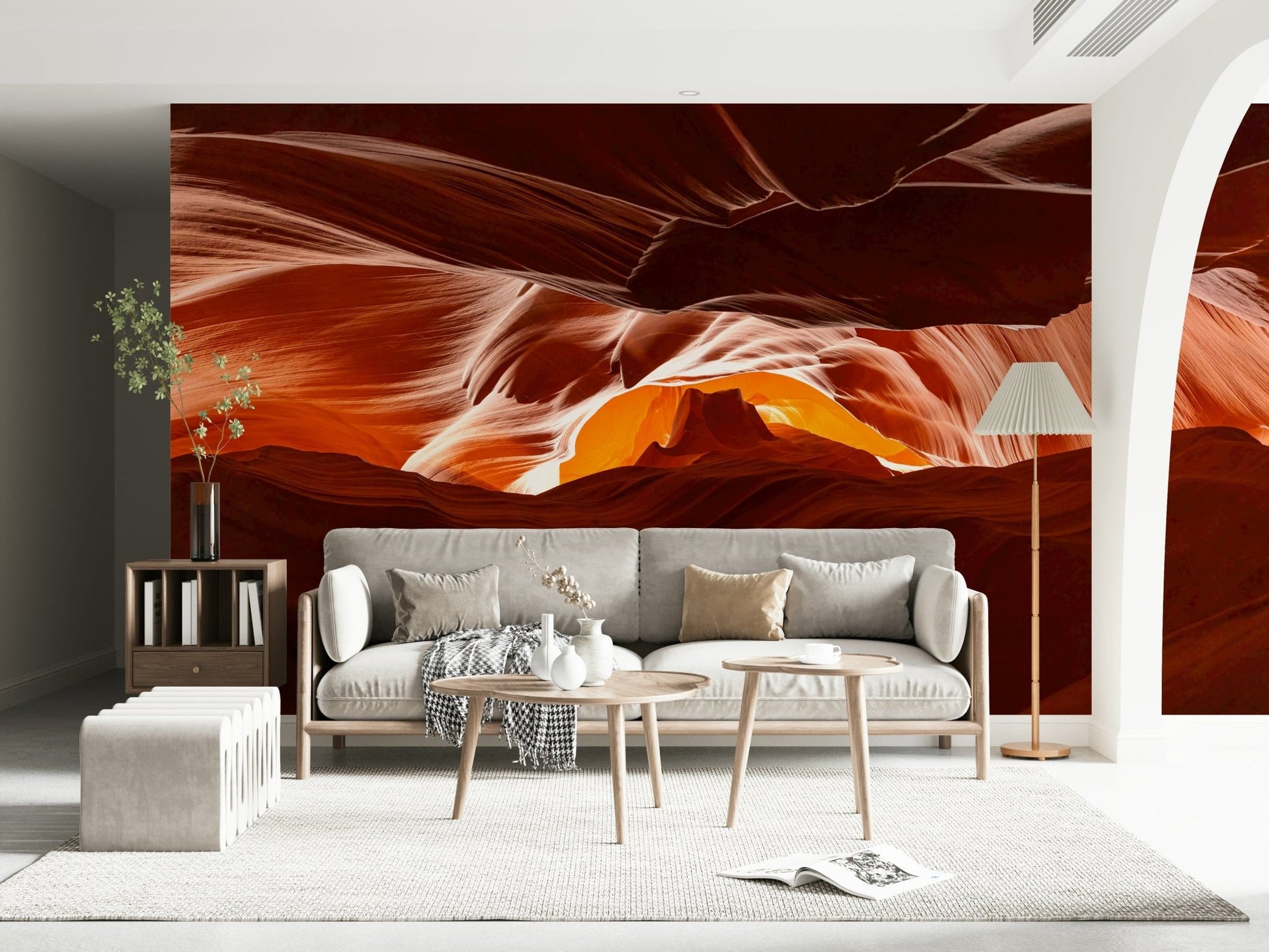 Minimalist bedroom featuring a nature-themed mural behind a wooden bed frame.