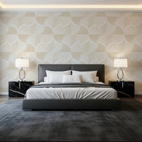 Art Deco Botanical Palm Fan Soft White Beige wallpaper behind a grey leather bed and black marble nightstands