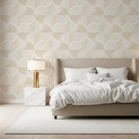 Art Deco Botanical Palm Fan Soft White Beige wallpaper behind a beige bed with a gold lamp in a bedroom
