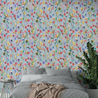 Airy watercolor flower mural with soft petals and stems.

