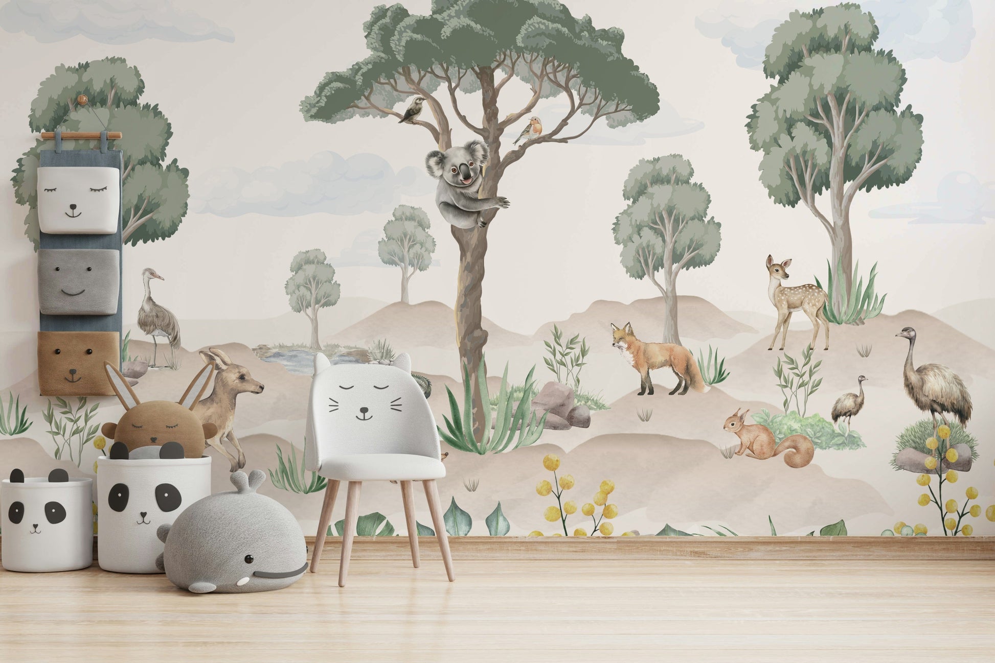 A nursery decorated with a wildlife mural

