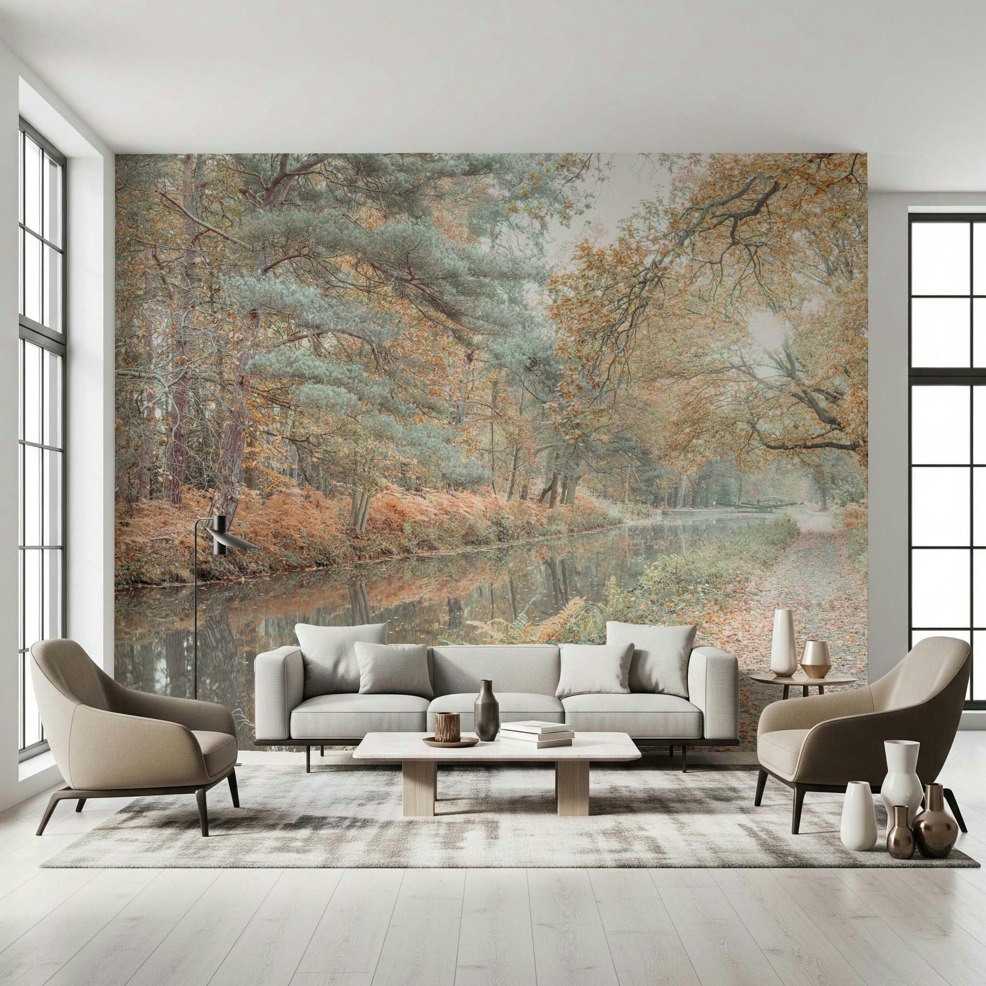 Nature wall mural with muted fall colors, tall trees, and a glassy river reflection.