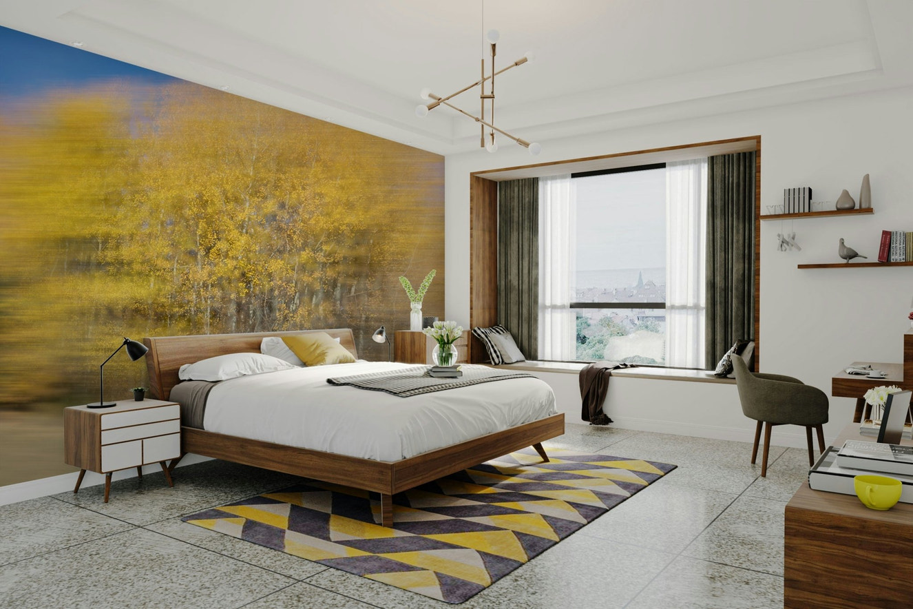 An abstract wall mural showing autumn trees with a motion blur effect.

