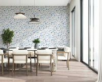 Close up of the detailed blue petals and garden stems on wall decor.